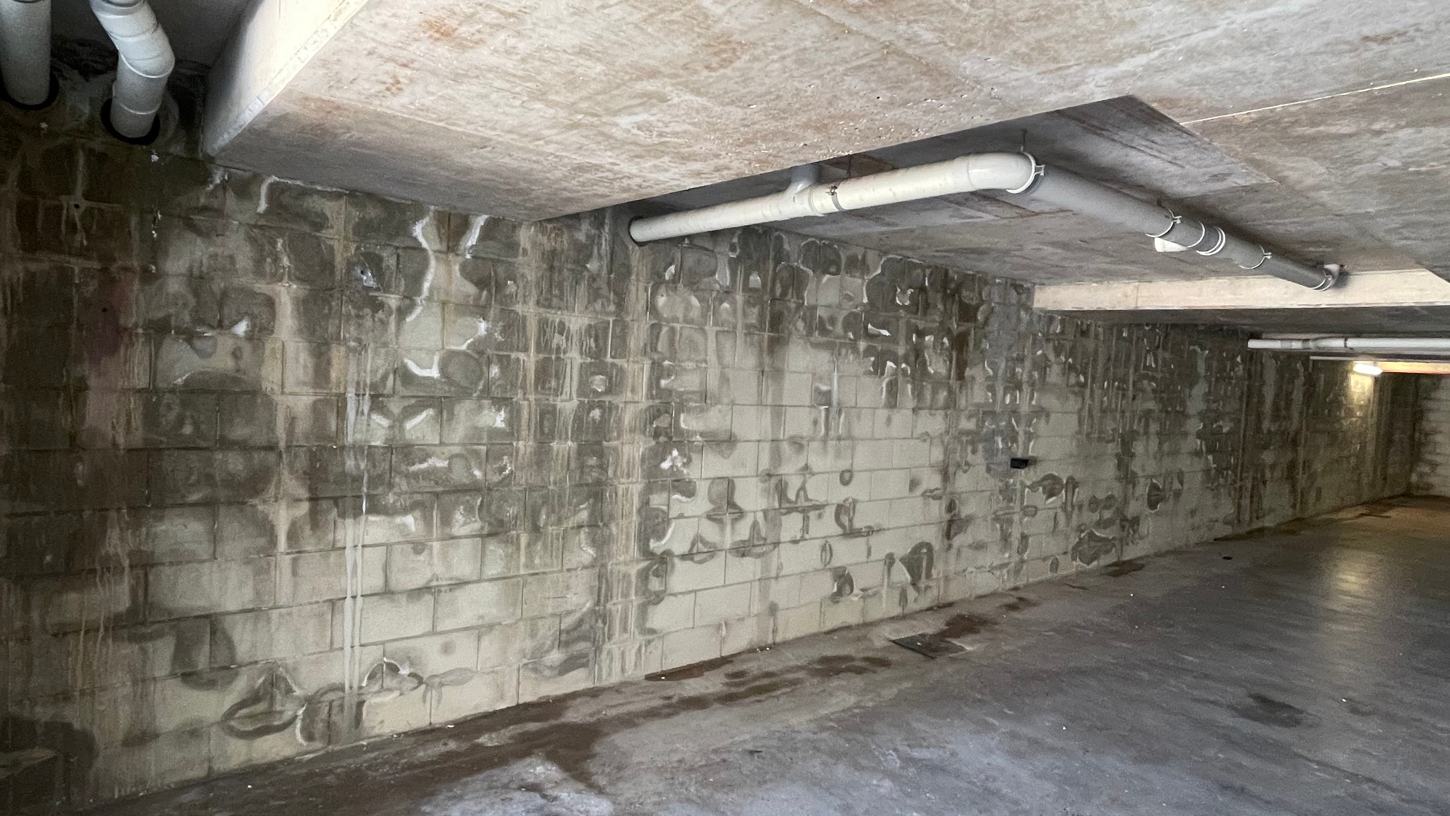 Dark Stains on Basement walls Indicate Water Seeping through Walls Due to Hydrostatic Pressure